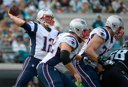New England quarterback Tom Brady (12) and the Patriots can earn a first round bye with a victory over Miami and a loss from either the Houston Texans or Denver Broncos.