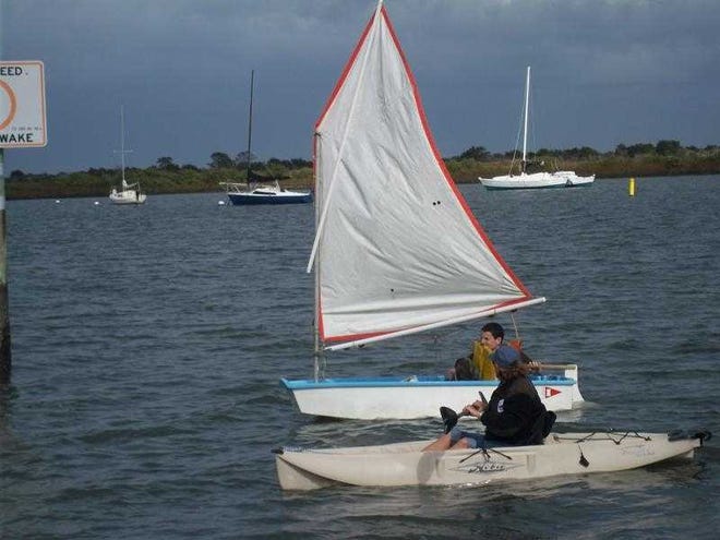 Instructor Wendy Thomson assists Cadet Christian Cousart in the fundamentals of sailing. Contributed photo.