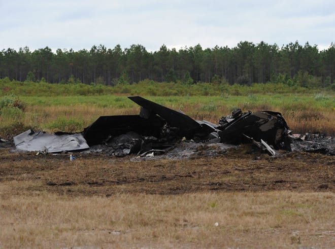 Burned pieces are all that is left of the F-22 Raptor that crashed in November. The pilot safely ejected from the aircraft.