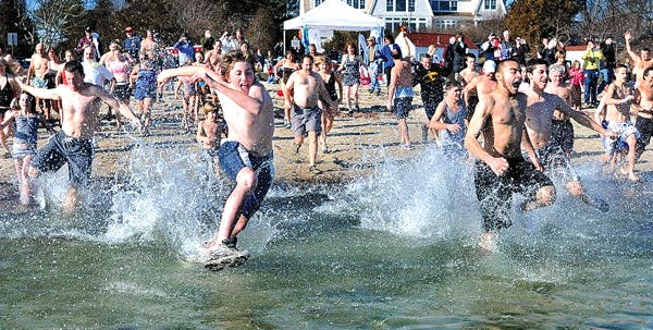 Members of the Polar Bear Club, shown here on Jan. 1, 2012, will take the plunge again at Loop Beach in Cotuit at noon on Tuesday.