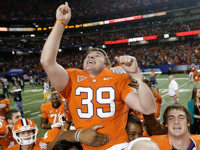 Clemson's Chandler Catanzaro is hoisted by teammates after kicking the game-winning field goal to cap the Tigers' rally in a 25-24 victory against LSU in the Chick-fil-A Bowl on Monday night in Atlanta.