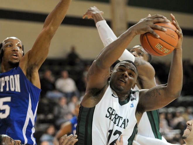 USC Upstate's Ricardo Glenn (12) comes down with an offensive rebound in heavy traffic against Hampton on Wednesday night at the Hodge Center. The Spartans held a 46-32 rebounding advantage in a 68-49 win.