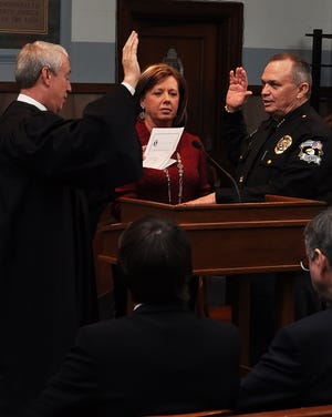 Oklahoma County Sheriff John Whetsel is sworn in Wednesday by District Judge Jerry Bass as his wife, Mitzi, watches. Photos provided