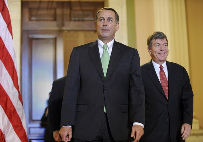 House Minority Leader John Boehner, R-Ohio, left, and Rep. Roy Blunt, R-Mo., right, walk out of the Republican conference meeting on the financial market turmoil on Capitol Hill in Washington, Friday, Oct. 3, 2008. (AP Photo/Susan Walsh)