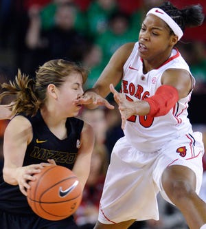 Georgia’s Jasmine James pops Missouri’s Lianna Doty in the nose during the Bulldogs’ 77-46 victory Thursday night in the SEC opener for both teams in Athens, Ga.