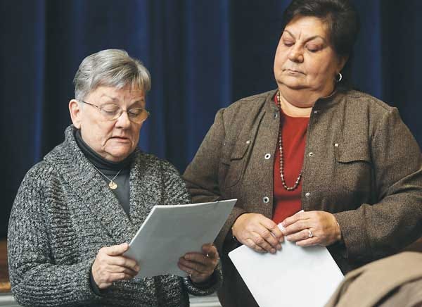 Photo by Daniel Freel/New Jersey Herald Sparta Board of Education member Karen Scott, left, takes the oath of office as Linda Alvarez, business administrator/board secretary, stands by during the reorganization meeting Thursday.