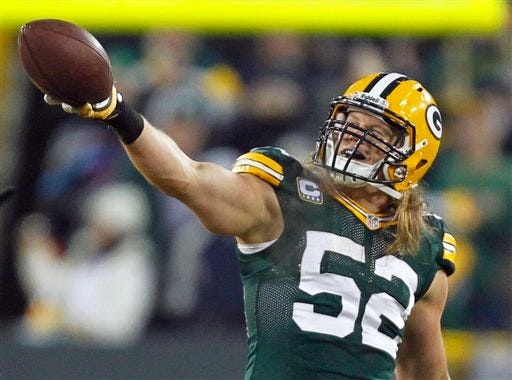 Green Bay Packers outside linebacker Clay Matthews (52) celebrates after recovering a fumble during the second half of Saturday's wild card playoff game against the Minnesota Vikings.