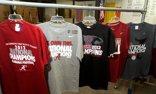Shirts proclaiming the University of Alabama as National Champions are prepared Friday in the stock room at Martin's Family Clothing in Rainbow City. If Alabama wins, the store will open after the game, and the clothing items will be sold until 2 a.m.