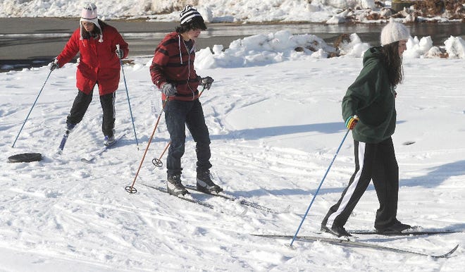 Jade Rubenstein, 12, front; her brother Aidan, 15; and mother Jolie DeFeis of Milford get some cross-country skiing practice in their class on Sunday afternoon before hitting the trail at Pocono Environmental Education Center in Dingmans Ferry.