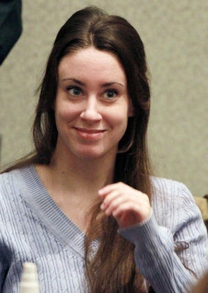 FILE - In this July 7, 2011 file photo, Casey Anthony smiles before the start of her sentencing hearing in Orlando, Fla. A state appellate court is being asked to decide Tuesday Jan. 8, 2013 whether the Florida mother was in police custody when she made the statements that led to her being convicted of lying to law enforcement officers. (AP Photo/Joe Burbank, File)