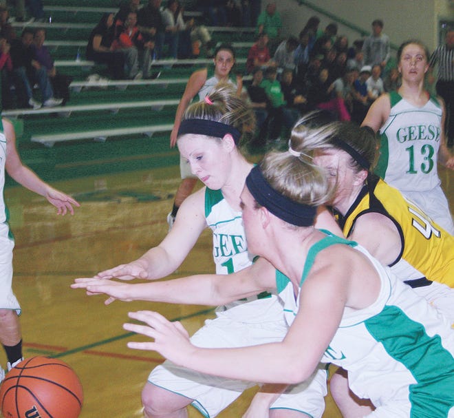 Wethersfield's Caitlin Miller and Kodi Hammer scramble for a loose ball during Wednesday night's LTC game with ROWVA.