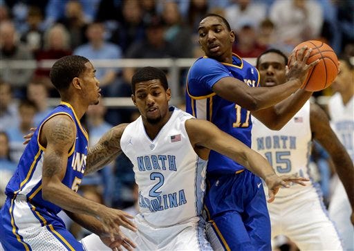 North Carolina's Leslie McDonald (2) guards McNeese State's Kevin Hardy (11) as Hardy looks to pass to Dontae Cannon, left, during the first half of an NCAA college basketball game in Chapel Hill, N.C., Saturday, Dec. 22, 2012. (AP Photo/Gerry Broome)