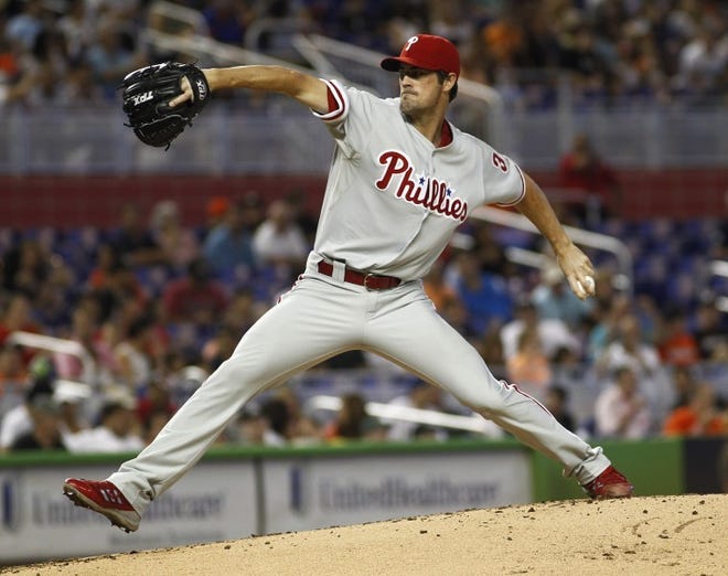 Philadelphia starter Cole Hamels pitches during the second inning against the Marlins in Miami on Sunday.