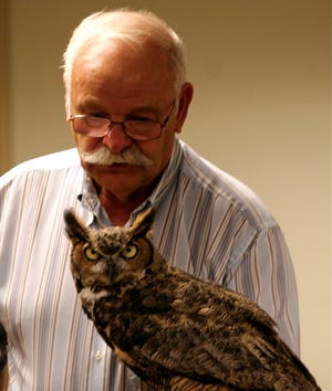 Tom Ricardi with a great horned owl at a previous birds of prey program.