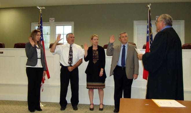 Courtesy of Eddie Warren/For Bryan County Now Bryan County Probate Judge Sam Davis (far right) swears in Board of Education members last Friday at the county annex building in Richmond Hill. From left to right: Marianne Smith (District 4), Dennis Seger (District 2), Amy Murphy (District 3) and Joe Pecenka (Vice Chairman).