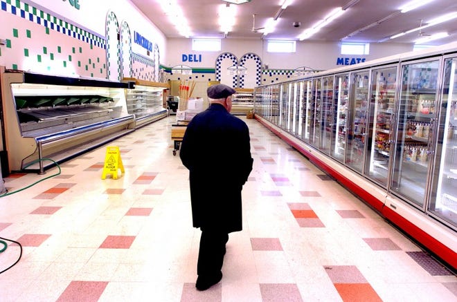 Moorestown resident Charles Robinson walks through the Acme supermarket on Chester Avenue prior to closing its doors in February 2006. Supervalu said Thursday the sale of 877 stores to an investor group led by Cerberus Capital Management also includes Albertson's, Jewel-Osco, Shaw's and Star Market. The sale includes Burlington County Acme stores in Willingboro, Medford, Bordentown Township, Burlington Township, Mount Holly, Pemberton Township and two in Maple Shade.