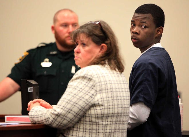 Eric Purnell Gilyard, right, stands with his defense attorney Marcella Beeching while appearing before Judge A.W. Nichols III on Thursday morning, Jan. 10, 2012. Gilyard pled no contest to his charges, including robbery with a firearm, and was sentenced to 10 years in prison. By DARON DEAN, daron.dean@staugustine.com