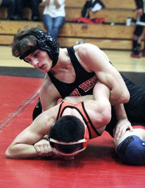 Josh Hawkins (New Bern, 120 pounds) wrestles New Hanover’s Kennan Cromshaw during Saturday’s Mideastern Conference duals at New Bern High. Hawkins pinned Cromshaw in 2:35 to win the round.