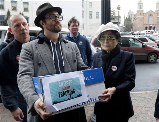 Sean Lennon and Yoko Ono help deliver boxes of comments to the New York State Department of Environmental Conservation on its proposed natural gas drilling regulations on Friday in Albany, N.Y. Environmental, health and community groups opposed to shale gas drilling and hydraulic fracturing, or "fracking," say they collected more than 200,000 comments during an intense 30-day effort featuring online coaching and comment-writing workshops at churches, community centers, food co-ops, coffee shops and holiday house parties from New York City to Buffalo.