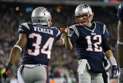 New England Patriots running back Shane Vereen, left, is congratulated by quarterback Tom Brady after Vareen's eight-yard touchdown pass reception from Brady during the first half of an AFC divisional playoff NFL football game in Foxborough, Mass., Sunday, Jan. 13, 2013.