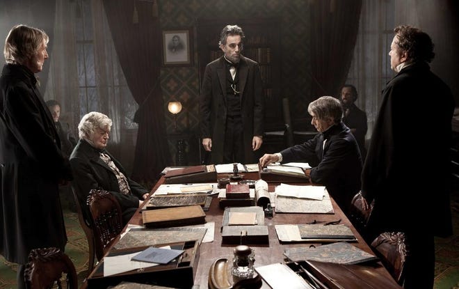 This undated publicity photo provided by DreamWorks and Twentieth Century Fox shows Daniel Day-Lewis, center, as Abraham Lincoln in a scene from the film "Lincoln."