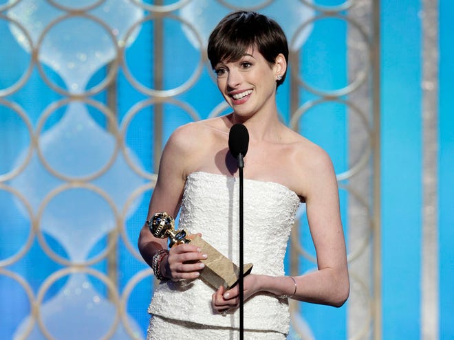 This image released by NBC shows Anne Hathaway with her award for best supporting actress in a motion picture for her role in "Les Miserables" during the 70th Annual Golden Globe Awards at the Beverly Hilton Hotel Sunday in Beverly Hills, Calif. (AP Photo/NBC, Paul Drinkwater)