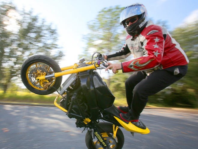 Joel Hickman performs a stunt on his modified 2004 Kawasaki Ninja.
