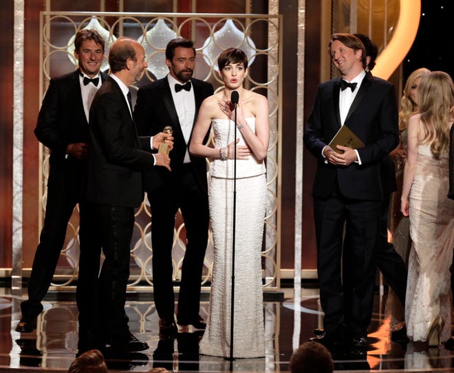 PAUL DRINKWATER | NBC | ASSOCIATED PRESS
Actress Anne Hathaway, center, speaks onstage Sunday with the cast and crew of "Les Miserables" after the film won for best musical or comedy during the 70th Annual Golden Globe Awards at the Beverly Hilton Hotel in Beverly Hills, Calif.