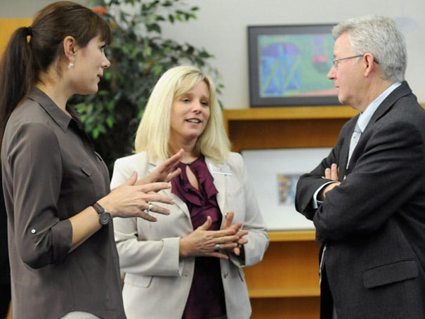 Board of Education members Lisa Estep (from left) and Tammy Covil speak with Rep. Rick Catlin before the start of the New Hanover County Schools Legislative Luncheon at the New Hanover County Board of Education Center Tuesday, Jan. 15, 2013.