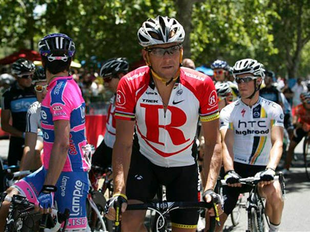 In this Jan. 23, 2011 file photo American Lance Armstrong, rides for Team Radio Shack, during the final stage of the Tour Down Under cycling event in Adelaide, Australia. The government of South Australia state said Tuesday, Jan. 15, 2013, it will seek damages or compensation from Armstrong after his reported confession to Oprah Winfrey that he doped during his career. (AP Photo/James Knowler, File)