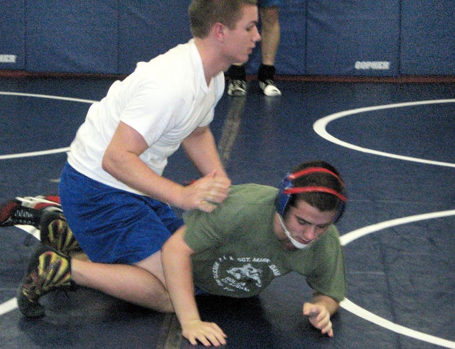 West Craven wrestler Anthony Parson (white shirt) works in practice Tuesday with teammate Aaron Roach. Parson is 30-7 at 182 pounds for the Eagles this season.
