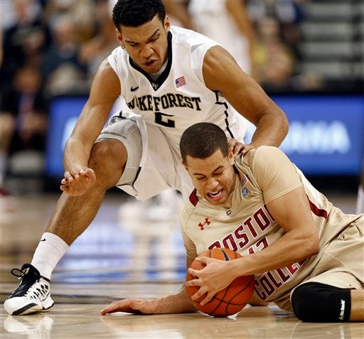 Wake Forest's Devin Thomas, top, and Boston College's Ryan Anderson scramble for a loose ball in Saturday's game.