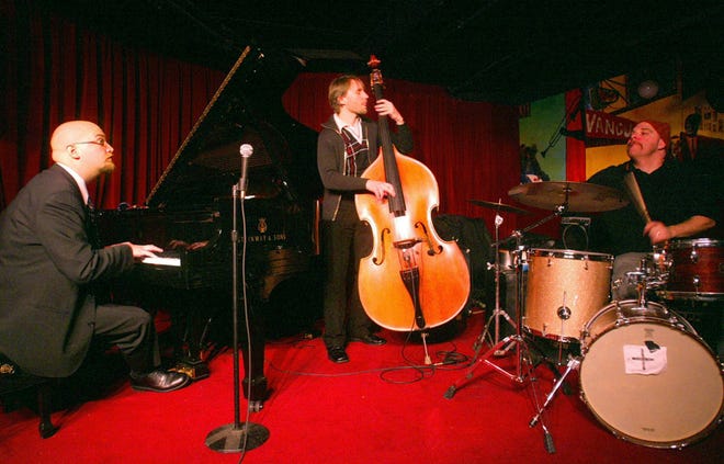 The Bad Plus, from left, Ethan Iverson, Reid Anderson and David King, perform during a 2003 show at the Village Vanguard in New York City.