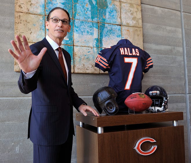 Chicago Bears NFL football team new head coach Marc Trestman poses in the lobby of Halas Hall after being introduced as the teams new head coach during a press conference Thursday, Jan. 17, 2013, in Lake Forest, Ill. (AP Photo/Jim Prisching)