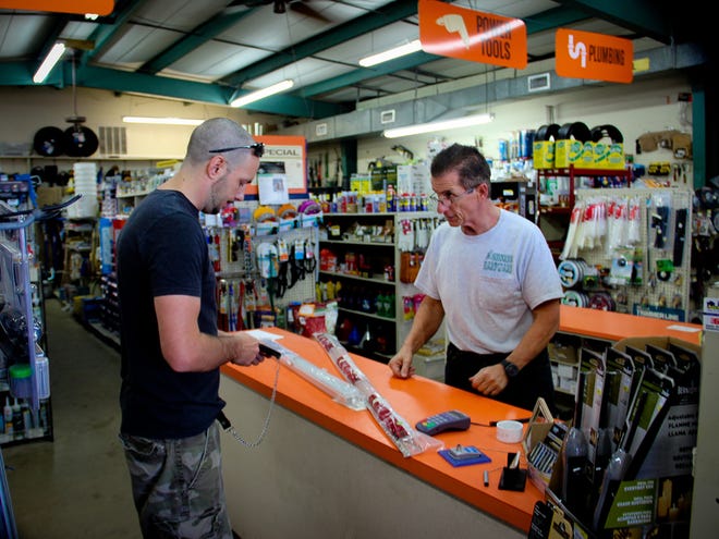 Steve Prediletto, owner of Shores Hardware Store on Maricamp road in Silver Springs Shores, Fla., on Saturday January 14, 2013 helps a customer Saturday afternoon. He has been operating Shores Hardware since 1978 and has complete confidence his store will continue to thrive in the new year.