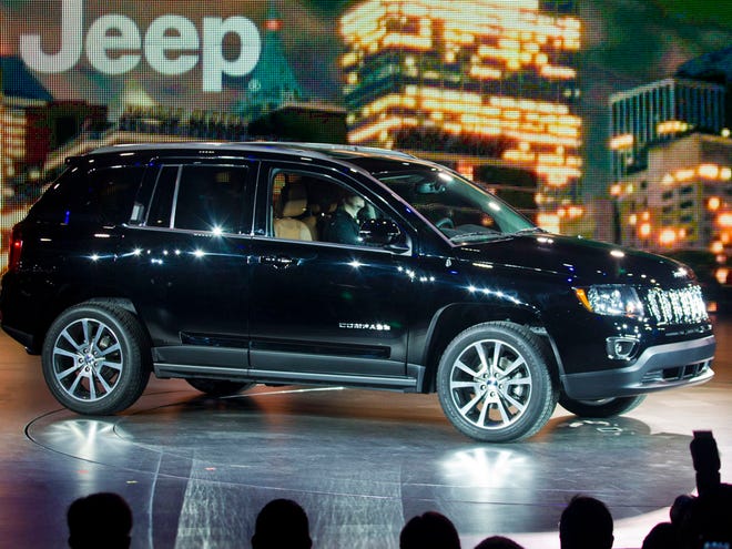 The 2013 Jeep Compass is introduced at the North American International Auto Show, Monday, Jan. 14, 2013, in Detroit, Mich. (AP Photo/Tony Ding)