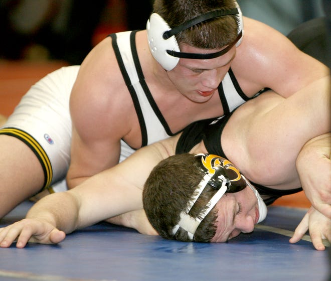 Perry’s JoJo Tayse takes control over Riverside’s Evan Rosborough during the 195-pound title match at Saturday’s Top Gun Tournament at Alliance High School. Tayse won the match, 6-2.