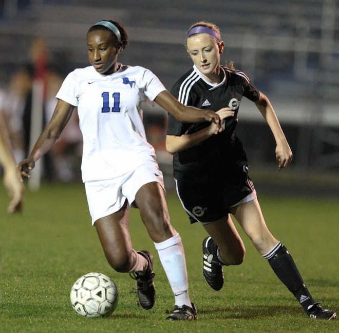 Creekside's Abigail Logue and Bartram Trail's Lauren Small battle for the ball Wednesday during the first half of a District 4-3A semifinal match at Bartram.