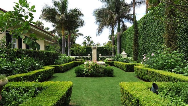 The Via Palma property’s elaborate gardens were planted when the house was owned by Sotheby’s International Realty agent Ted Gossett.