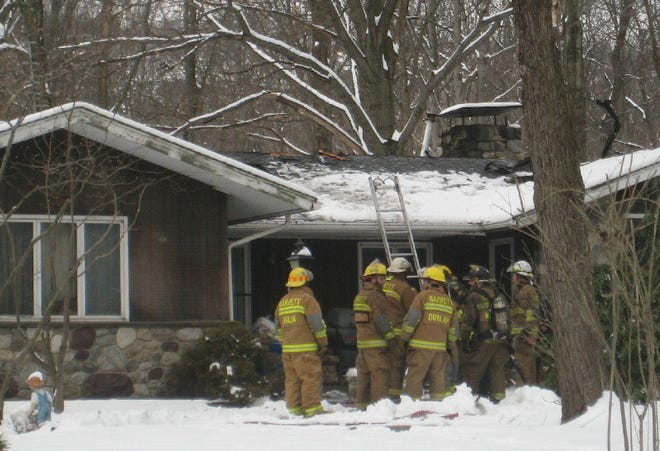 Firefighters work at the scene of a house fire in Cresco on Thursday. The fire is suspected to have started from a pellet stove damaging the home around 11 a.m. The fire spread to the roof of the ranch-style house on the corner of Hardytown Road and Route 191 in Barrett Township, and was declared under control about 11:30 a.m. The homeowner was home when the blaze broke out, but no one was injured. Barrett Township Fire Department responded to the call.