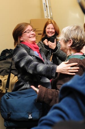 Jessica Wisneski of Citizen Action, left, hugs another Tkaczyk supporter once the results of the 46th senate race were announced at the Ulster County Board of Elections in Kingston. Tkaczyk, a Democrat, defeated Republican George Amedore by 19 votes.