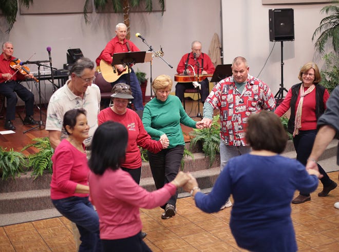 Callaway residents move in a circle during a barn dance on Thursday in Callaway.