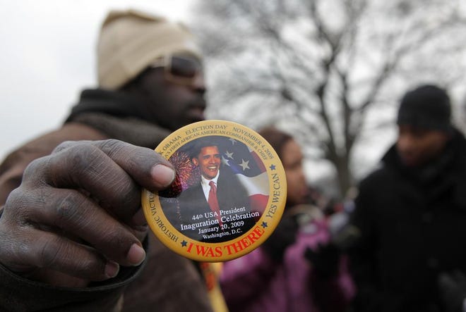 Rob Jackson sells "I Was There" buttons Monday, Jan. 19, 2009, outside the United States Capitol in Washington, D.C.