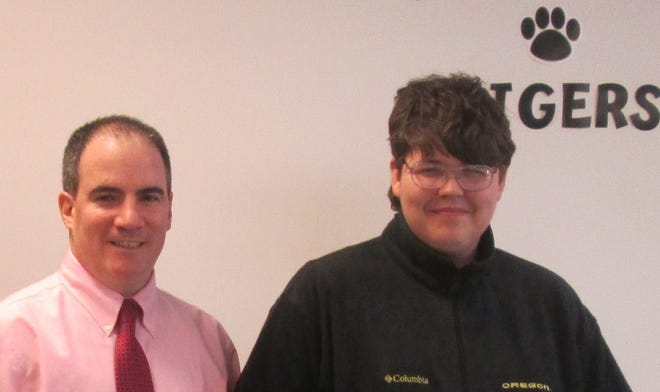 TASC mentor Joe Sollecito, manager of Customer Care at Taunton Municipal Lighting Plant with his mentee Jonathan Wade.