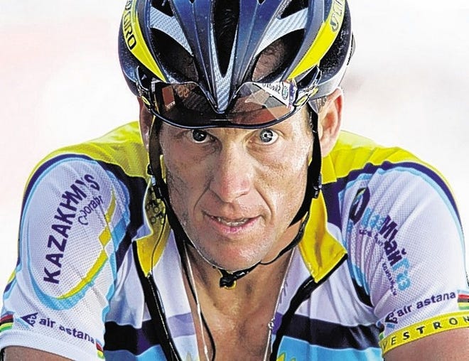 FILE - In this July 19, 2009, file photo, Lance Armstrong crosses the finish line during the 15th stage of the Tour de France cycling race in Verbier, Switzerland. Armstrong confessed to using performance-enhancing drugs to win the Tour de France during a taped interview with Oprah Winfrey that aired Thursday, Jan. 17, 2013, reversing more than a decade of denial. (AP Photo/Laurent Rebours, File)
