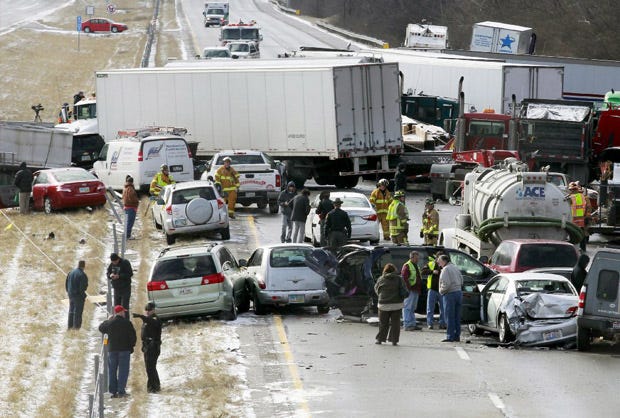 Semi-trucks and other vehicles involved in a mulit-car crash are strewn across westbound Interstate 275 between Colerain Avenue and Hamilton Avenue in Cincinnati.