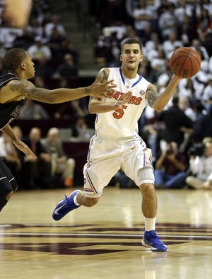 David J. Phillip Associated Press Florida's Scottie Wilbekin passes against Texas A&M during last Thursday's game in College Station, Texas.