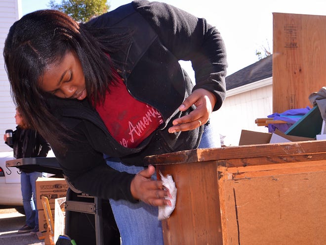 Volunteers, including Tiana Butler with AmeriCorps, help clean up and organize Monday at The Haven homeless shelter in Spartanburg. The group helped out as part of MLK Service Day, in honor of the Rev. Martin Luther King Jr.