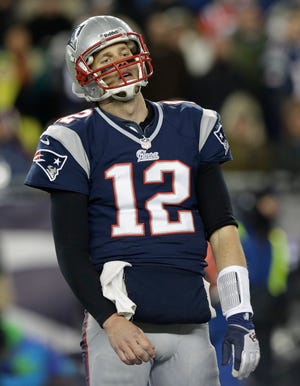 Patriots quarterback Tom Brady reacts after throwing an incomplete pass during the second half of New England's 28-13 loss to the Ravens on Sunday in the AFC championship game.