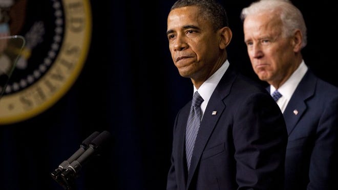 President Barack Obama and Vice President Joe Biden at a news conference where Obama signed 23 executive actions on gun control.